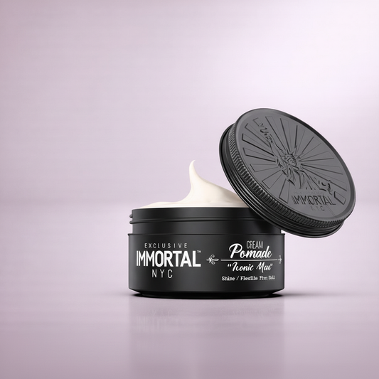 IMMORTAL NYC Cream Pomade with open lid on beige background